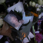 
              Messages, flowers and candles are seen at the gates of Buckingham Palace in London, Friday, Sept. 9, 2022. Queen Elizabeth II, Britain's longest-reigning monarch and a rock of stability across much of a turbulent century, died Thursday Sept. 8, 2022, after 70 years on the throne. She was 96. (AP Photo/Kirsty Wigglesworth)
            