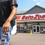 
              FILE - A man carrying a firearm on his hip for protection leaves an Auto Zone store, Thursday, Sept. 8, 2022, in Memphis, Tenn. On Thursday, Sept. 13, 2022, police revised the number of people killed in a man's shooting rampage from four to three after a different suspect was identified in the slaying of a teenager during the tense ordeal in Memphis. (AP Photo/John Amis, File)
            