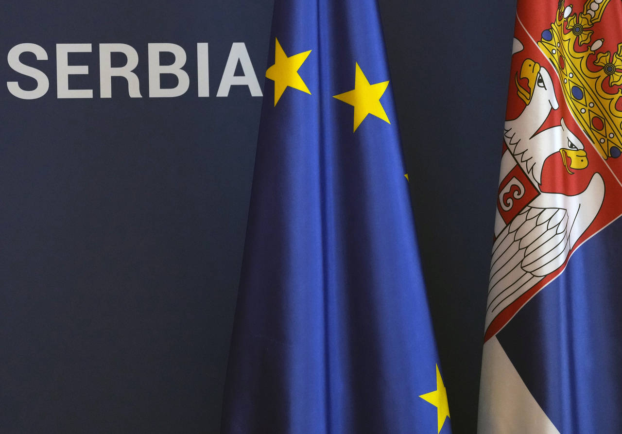 FILE - EU and Serbian flags are seen in the Serbia Palace during visit of Chinese Foreign Minister ...