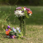 
              Flowers are placed in front of the home of a victim who has been identified by residents as  as Wes Petterson in Weldon, Saskatchewan, on Monday, Sept. 5, 2022.RCMP say arrest warrants have been issued for two suspects in a deadly stabbing rampage who remain at large. (Heywood Yu/The Canadian Press via AP)
            