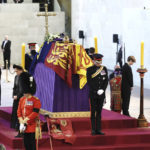 
              Prince William, the prince of Wales, Prince Harry,  Princess Beatrice, Lady Louise, Zara Tindall, Peter Phillips, Viscount James Severn and Princess Eugenie mount the vigil of the Queen's grandchildren around the coffin, as it lies in state on the catafalque in Westminster Hall, at the Palace of Westminster, London, Saturday,  Sept. 17, 2022, ahead of her funeral on Monday. (Aaron Chown/Pool Photo via AP)
            