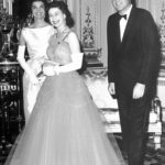 
              FILE - Queen Elizabeth II, center, walks with U.S. President John F. Kennedy, right, and his wife Jacqueline Kennedy, as they enter an ante-room in Buckingham Palace, London, June 5, 1961, before a dinner given by the Queen in honour of the visiting President and his wife. Queen Elizabeth II, Britain's longest-reigning monarch and a rock of stability across much of a turbulent century, died Thursday, Sept. 8, 2022, after 70 years on the throne. She was 96. (AP Photo, File)
            