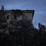 
              An apartment building damaged after a Russian attack is seen during the dusk in Kramatorsk, Ukraine, Monday, Sept. 26, 2022. (AP Photo/Leo Correa)
            