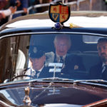 
              Britain's King Charles III, center, and Camilla, the Queen Consort are driven along the Royal Mile towards the Palace of Holyroodhouse, in Edinburgh, Scotland, Monday, Sept. 12, 2022. King Charles arrived in Edinburgh on Monday to accompany his late mother’s coffin on an emotion-charged procession through the historic heart of the Scottish capital to a cathedral where it will lie for 24 hours to allow the public to pay their last respects. (Odd Andersen/Pool Photo via AP)
            