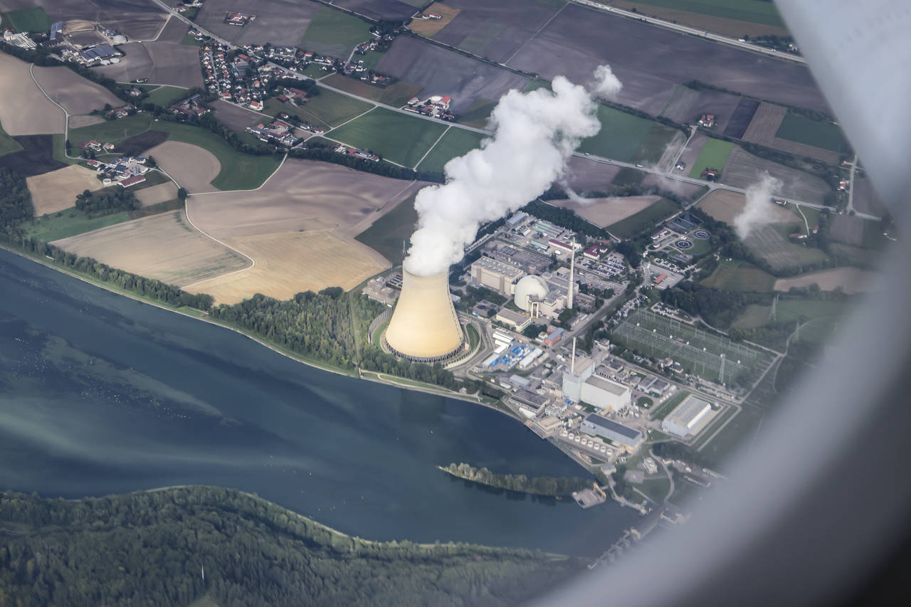 FILE - Steam gushes out of the cooling tower of the Isar 2 nuclear power plant in Essenbach, German...