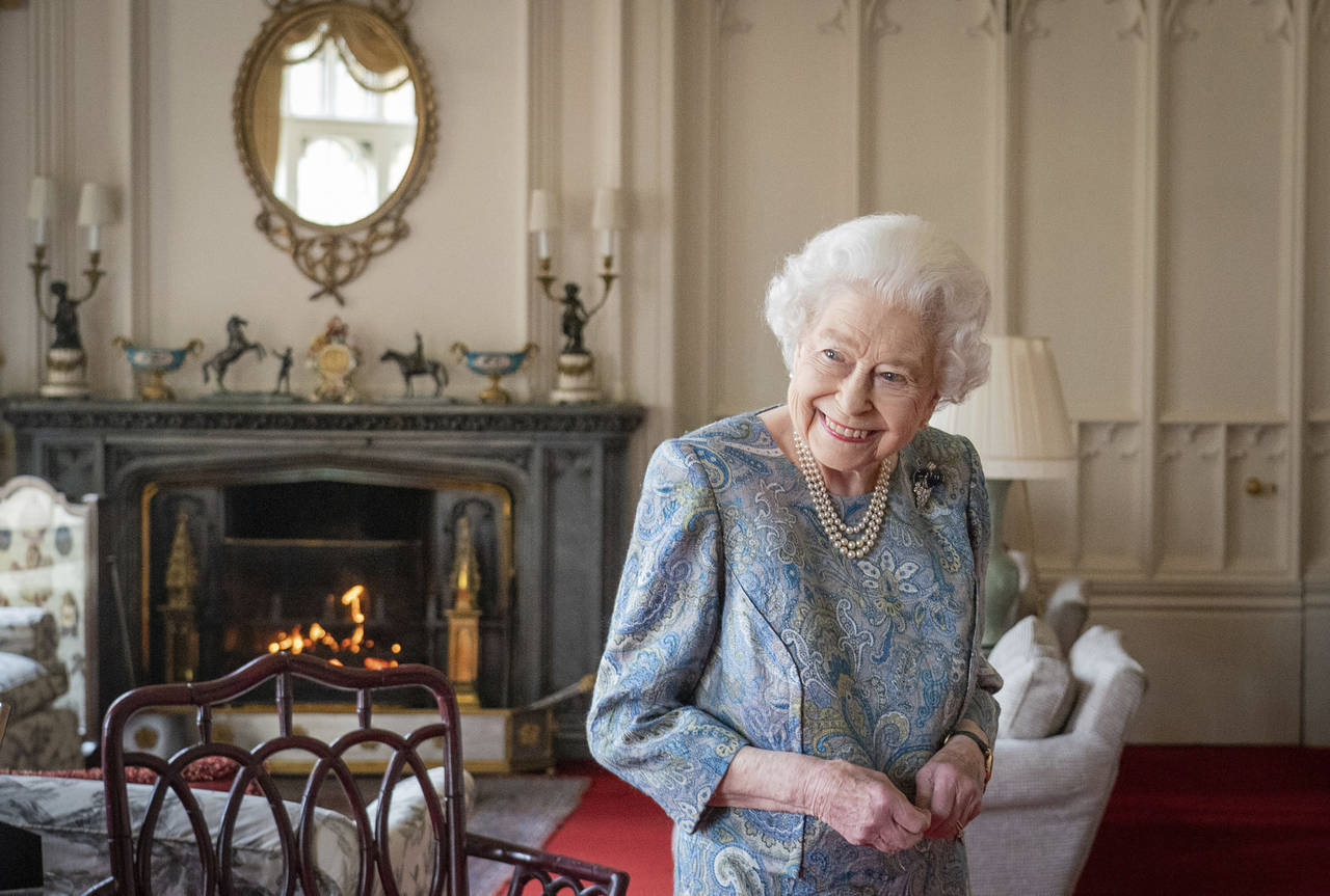 FILE - Britain's Queen Elizabeth II smiles while receiving the President of Switzerland Ignazio Cas...