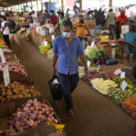 
              FILE - A man shops for vegetables at a market in Colombo, Sri Lanka, Friday, June 10,2022. The Asian Development Bank said Tuesday, Sept. 27, 2022, it will devote at least $14 billion through 2025 to help ease a worsening food crisis in the Asia-Pacific. (AP Photo/Eranga Jayawardena, File)
            