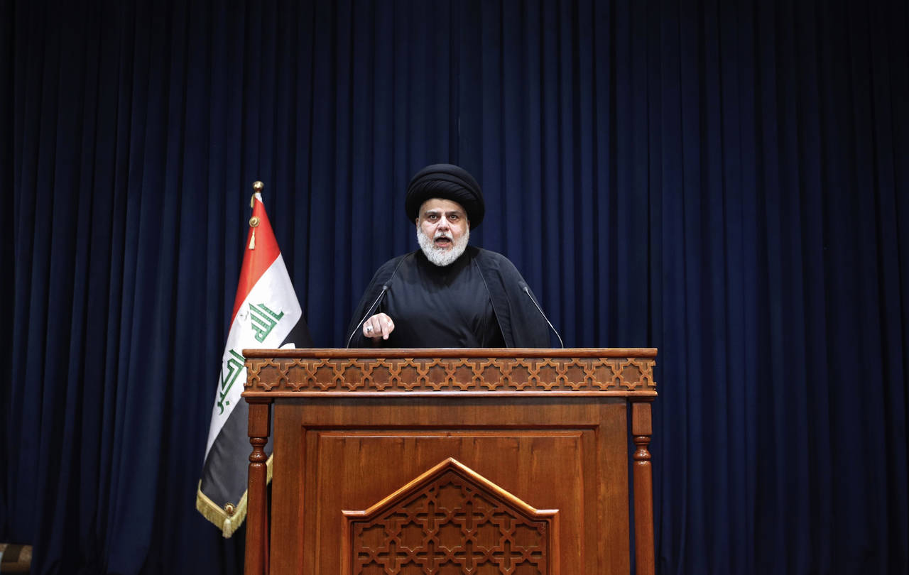 FILE - Influential Shiite cleric Muqtada al-Sadr, makes a speech calling on his supporters to withd...