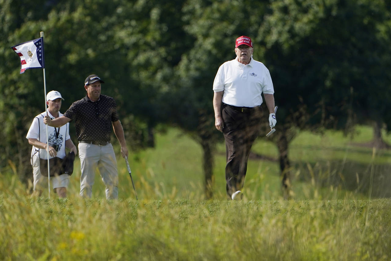 Former President Donald Trump plays golf at Trump National Golf Club in Sterling, Va., Tuesday, Sep...