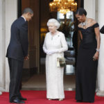 
              FILE - U.S. President Barack Obama and first lady Michelle Obama welcome Queen Elizabeth II for a reciprocal dinner at Winfield House in London, May 25, 2011. Queen Elizabeth II, Britain's longest-reigning monarch and a rock of stability across much of a turbulent century, died Thursday, Sept. 8, 2022, after 70 years on the throne. She was 96. (AP Photo/Charles Dharapak, File)
            