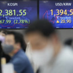 
              Currency traders watch computer monitors near the screens showing the Korea Composite Stock Price Index (KOSPI), left, and the foreign exchange rate between the U.S. dollar and the South Korean won at a foreign exchange dealing room in Seoul, South Korea, Wednesday, Sept. 14, 2022. Asian markets have skidded lower after Wall Street fell the most since June 2020 as a report showed inflation has kept a surprisingly strong grip on the U.S. economy.  (AP Photo/Lee Jin-man)
            