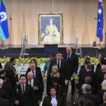 
              Australian Governor-General David Hurley, center left, and Australian Prime Minister Anthony Albanese, rear center left, leave at the end of the national memorial service for Queen Elizabeth II at Parliament House in Canberra, Thursday, Sept. 22, 2022. An Australian national day of mourning for the late Queen Elizabeth II on Thursday centered on Parliament House, where dignitaries placed sprigs of golden wattle, the national floral emblem, in a wreath. (Lukas Coch/AAP Image via AP)
            