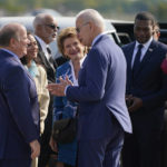 
              President Joe Biden speaks with Sen. Debbie Stabenow, D-Mich., Detroit Mayor Mike Duggan, left, and wife Sonia Hassan as he arrives at Detroit Metropolitan Airport, Wednesday, Sept. 14, 2022, in Detroit. Rep. Debbie Dingell, D-Mich., right, stands with Environmental Protection Agency Administrator Michael Regan. (AP Photo/Evan Vucci)
            