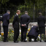 
              Members of the British Royal family view the floral tributes to Queen Elizabeth II outside the gates of Balmoral Castle in Aberdeenshire, Scotland Saturday, Sept. 10, 2022. Queen Elizabeth II, Britain's longest-reigning monarch and a rock of stability across much of a turbulent century, died Thursday after 70 years on the throne. She was 96. (AP Photo/Alastair Grant)
            