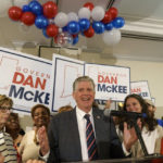 
              Rhode Island Gov. Dan McKee, joined by Lt. Gov. Sabina Matos, right, gives an acceptance speech in front of supporters at a primary election night watch party in Providence, R.I., Tuesday, Sept. 13, 2022. (AP Photo/David Goldman)
            