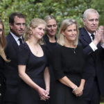 
              From left, Britain's Princess Beatrice, Peter Phillips, Lady Louise Windsor, Zara Tindall, Sophie Countess of Wessex and Prince Andrew,gesture to the members of the public after looking at the floral tributes for Queen Elizabeth II, as others look on, outside the gates of Balmoral Castle in Aberdeenshire, Scotland Saturday, Sept. 10, 2022. Queen Elizabeth II, Britain's longest-reigning monarch and a rock of stability across much of a turbulent century, died Thursday after 70 years on the throne. She was 96. (AP Photo/Scott Heppell)
            