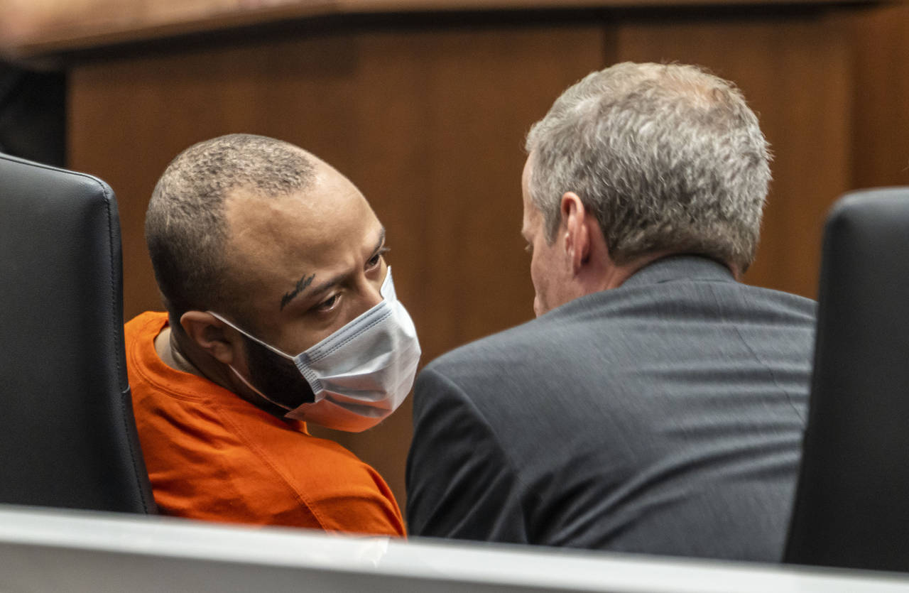 Darrell Brooks Jr., left, speaks with his attorney Jeremy Perri, during a jury status hearing on Fr...