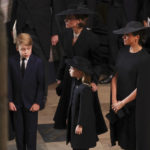 
              Britain's Kate, Princess of Wales, Meghan, Duchess of Sussex, Prince George and Princess Charlotte arrive at the Westminster Abbey for the funeral of Queen Elizabeth II, in London, Monday Sept. 19, 2022. (Phil Noble/Pool Photo via AP)
            