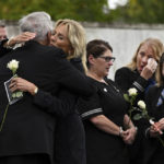 
              First lady Jill Biden hugs Jeff Heisey, a member of the Association of Flight Attendants, at the Flight 93 National Memorial Wall of Names following a ceremony commemorating the 21st anniversary of the Sept. 11, 2001 terrorist attacks in Shanksville, Pa., Sunday, Sept. 11, 2022. (AP Photo/Barry Reeger)
            