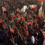 
              Supporters of Pakistani opposition leader Imran Khan's Tehreek-e-Insaf party attend a rally, in Peshawar, Pakistan, Tuesday, Sept. 6, 2022. Since he was toppled by parliament five months ago, former Prime Minister Imran Khan has demonstrated his popularity with rallies that have drawn huge crowds and signaled to his rivals that he remains a considerable political force. (AP Photo/Mohammad Sajjad)
            