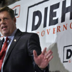 
              Massachusetts Republican gubernatorial candidate Geoff Diehl speaks to reporters at his primary night victory party, Tuesday, Sept. 6, 2022, in Weymouth, Mass. Diehl, a former GOP state representative from Whitman, Mass. endorsed by Donald Trump, beat businessman Chris Doughty for the chance to replace incumbent Republican Gov. Charlie Baker, who's opted not to seek a third term. (AP Photo/Josh Reynolds)
            