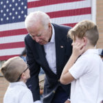 
              President Joe Biden talks to children before speaking at a United Steelworkers of America Local Union 2227 event in West Mifflin, Pa., Monday, Sept. 5, 2022, to honor workers on Labor Day. (AP Photo/Susan Walsh)
            