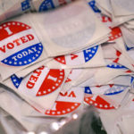 
              A bin of "I Voted Today" stickers rests on a table at a polling place, Tuesday, Sept. 13, 2022, in Stratham, N.H. (AP Photo/Charles Krupa)
            