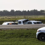 
              Police and investigators gather at the scene where a stabbing suspect was arrested in Rosthern, Saskatchewan on Wednesday, Sept. 7, 2022. Canadian police arrested Myles Sanderson, the second suspect in the stabbing deaths of multiple people in Saskatchewan, after a three-day manhunt that also yielded the body of his brother fellow suspect, Damien Sanderson. (AP Photo/Robert Bumsted)
            