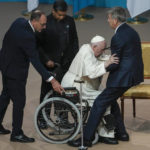 
              Pope Francis is helped stand up as he arrives at a meeting with authorities, civil society and diplomats at Qazaq Concert Hall in Nur-Sultan, Kazakhstan, Tuesday, Sept. 13, 2022. Pope Francis begins a 3-days visit to the majority-Muslim former Soviet republic to minister to its tiny Catholic community and participate in a Kazakh-sponsored conference of world religious leaders. (AP Photo/Alexander Zemlianichenko)
            
