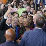 
              President Joe Biden takes a selfie Sen. Elizabeth Warren, D-Mass., and audience members at Boston Logan International Airport, Monday, Sept. 12, 2022, in Boston, where he delivered remarks on the Bipartisan Infrastructure Law. (AP Photo/Evan Vucci)
            