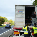 
              Czech policemen control a truck at the border with Slovakia in Stary Hrozenkov, Czech Republic, Thursday, Sept. 29, 2022. The Czech government has decided to renew checks at its border with Slovakia amid a new wave of migration. The new measure became effective on Thursday at 27 border crossings between the two European Union countries that belong to Europe's visa-free Schengen zone and will last for at least 10 days. (AP Photo/Petr David Josek)
            