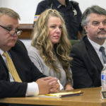 
              FILE - Lori Vallow Daybell, center, sits between her attorneys for a hearing at the Fremont County Courthouse in St. Anthony, Idaho, on Aug. 16, 2022. An Idaho judge has banned cameras from the courtroom in the high-profile triple murder case against a mom and her new husband, saying he fears the images could prevent a fair trial. Lori Vallow Daybell and her new husband Chad Daybell are accused of conspiring together to kill her two children and his late wife. (Tony Blakeslee/East Idaho News via AP, Pool, File)
            