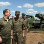 
              FILE - Deputy head of Russia's Security Council and chairman of the United Russia party, Dmitry Medvedev, second left, visits Totsk military garrison in the Orenburg region, Russia, Friday, Aug. 5, 2022. Dmitry Medvedev, further upped the ante Tuesday, saying that Russia has the right to use nuclear weapons against Ukraine if its aggression poses threat to the Russian statehood.(Ekaterina Shtukina, Sputnik, Pool Photo via AP, File)
            