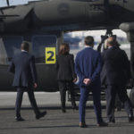 
              U.S. Vice President Kamala Harris, second left, walks to board a helicopter at Yokota Air Base on the outskirts of Tokyo Monday, Sept. 26, 2022. (Leah Millis/Pool Photo via AP)
            