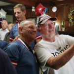 
              New Hampshire Republican U.S. Senate candidate Don Bolduc, center left, poses with supporter Mike Egan of Manchester, N.H., during a primary night campaign gathering, Tuesday, Sept. 13, 2022, in Hampton, N.H. (AP Photo/Reba Saldanha)
            