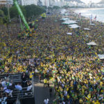 
              President Jair Bolsonaro delivers a speech to supporters at Copacabana beach during the independence bicentennial celebrations in Rio de Janeiro, Brazil, Wednesday, Sept. 7, 2022. (AP Photo/Rodrigo Abd)
            