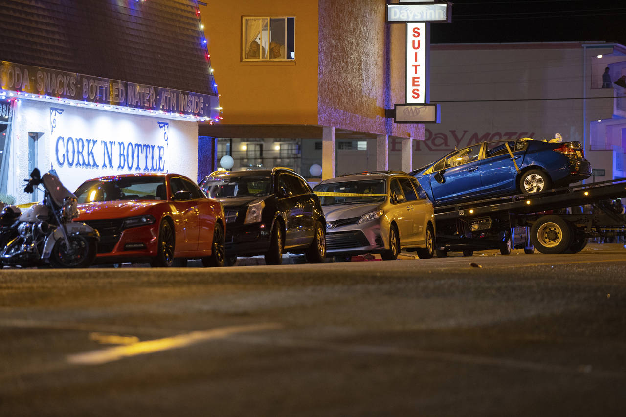 A blue Honda is loaded onto a flatbed tow truck in Wildwood, N.J., late Saturday, Sept. 24, 2022. A...