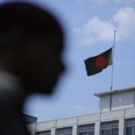
              Bangladesh's national flag flies at half-mast following the demise of Britain's Queen Elizabeth II in Dhaka, Bangladesh, Friday, Sept. 9, 2022. Britain's longest-reigning monarch and a rock of stability across much of a turbulent century, died Thursday Sept. 8, 2022, after 70 years on the throne. She was 96. (AP Photo/Mahmud Hossain Opu)
            