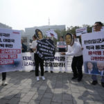 
              Protesters, two of them wearing masks of U.S. Vice President Kamala Harris and South Korean President Yoon Suk Yeol, stage a rally to oppose a visit by Harris, in front of the presidential office in Seoul, South Korea, Thursday, Sept. 29, 2022. The banners read "We denounced President Yoon Suk Yeol's government participating in South Korea-U.S.-Japan military alliance." (AP Photo/Ahn Young-joon)
            
