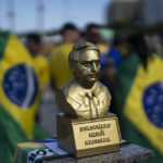 
              A statue depicting President Jair Bolsonaro and labeled as a national hero, sits on a podium during the country's Independence Day celebrations, on Copacabana Beach in Rio de Janeiro, Brazil, Wednesday, Sept. 7, 2022. Bolsonaro is waging an all-out campaign to shore up the crucial evangelical vote. (AP Photo/Rodrigo Abd)
            