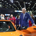 
              President Joe Biden gets into a Corvette during a tour of the Detroit Auto Show, Wednesday, Sept. 14, 2022, in Detroit. (AP Photo/Evan Vucci)
            