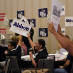 
              Supporters of Texas Gov. Greg Abbott cheer during his debate with Texas Democratic gubernatorial candidate Beto O'Rourke, Friday, Sept. 30, 2022, in McAllen, Texas. (AP Photo/Eric Gay)
            