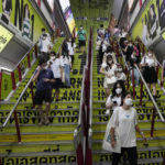 
              Commuters wearing face masks to help curb the spread of the coronavirus at a skytrain station in Bangkok, Thailand, Friday, Sept. 23, 2022. Thai officials announced Friday that Sept. 30 will mark the last day of a state of emergency originally imposed to control the spread of the coronavirus, as they also drop virtually all restrictions, such as entry requirements for visitors from abroad. (AP Photo/Sakchai Lalit)
            