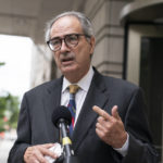 
              Attorney Ed Tarpley, speaks with reporters as he departs federal court, Wednesday, Sept. 7, 2022, in Washington. Tarpley filled a motion to represent Stewart Rhodes in the high-profile seditious conspiracy trial for the leader of the far-right Oath Keepers extremist group. U.S. District Judge Amit Mehta rejected a last-minute bid to replace his attorneys and delay his case. Mehta said Rhodes' suggestion that his lawyers are not providing effective counsel appear to be “complete and utter nonsense” and questioned why concerns about his lawyers are surfacing for the first time just weeks before trial. “The notion that you are going to create the kind of havoc that you will — and havoc is the only appropriate word I can think of — by moving Mr. Rhodes' trial, not going to happen,” Mehta told Tarpley whom Rhodes wanted as his new lawyer. (AP Photo/Alex Brandon)
            