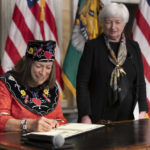 
              Secretary of the Treasury Janet Yellen watches as the new Treasurer of the United States Lynn Malerba's signature is collected to be used for the United States currency during a ceremony at the Treasury Department, Monday, Sept. 12, 2022 in Washington. Malerba becomes the first Native American to serve as Treasurer of the United States. (AP Photo/Manuel Balce Ceneta)
            