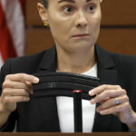 
              Broward Sheriff's Office Sgt. Gloria Crespo testifies about the weapon used by Marjory Stoneman Douglas High School shooter Nikolas Cruz in the 2018 shootings that has a swastika etched on the gun's magazine. This during the penalty phase of Cruz's trial at the Broward County Courthouse in Fort Lauderdale on Tuesday, Sept. 27, 2022. Sgt. Crespo took a photograph (for evidence purposes) of the gun used by Cruz after the shootings. Cruz previously plead guilty to all 17 counts of premeditated murder and 17 counts of attempted murder in the 2018 shootings. (Amy Beth Bennett/South Florida Sun Sentinel via AP, Pool)
            