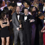 
              Jason Sudeikis, center, and the cast of "Ted Lasso" accept the Emmy for outstanding comedy series at the 74th Primetime Emmy Awards on Monday, Sept. 12, 2022, at the Microsoft Theater in Los Angeles. (AP Photo/Mark Terrill)
            