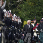
              King Charles III inspects the Guard of Honour as he arrives to attend the Ceremony of the Keys, at the Palace of Holyroodhouse, Edinburgh, Monday, Sept. 12, 2022. Queen Elizabeth II, Britain's longest-reigning monarch and a rock of stability across much of a turbulent century, died Thursday Sept. 8, 2022, after 70 years on the throne. She was 96. (Peter Byrne/Pool Photo via AP)
            