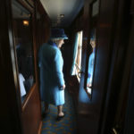
              FILE - In this Wednesday, Sept. 9, 2015 file photo, Britain's Queen Elizabeth II looks out of a window as she travels on a steam train en-route to Edinburgh in Scotland, Sept. 9, 2015. Queen Elizabeth II, Britain’s longest-reigning monarch and a rock of stability across much of a turbulent century, has died. She was 96. Buckingham Palace made the announcement in a statement on Thursday Sept. 8, 2022. (Andrew Milligan/PA Pool via AP, File)
            