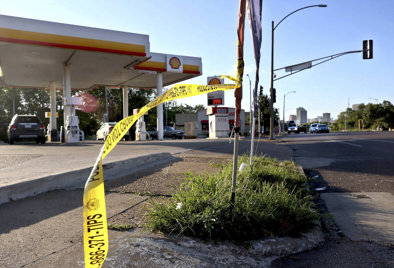 Crime scene tape blows in the wind on Monday, Sept. 12, 2022, near the scene in the 2800 block of N...